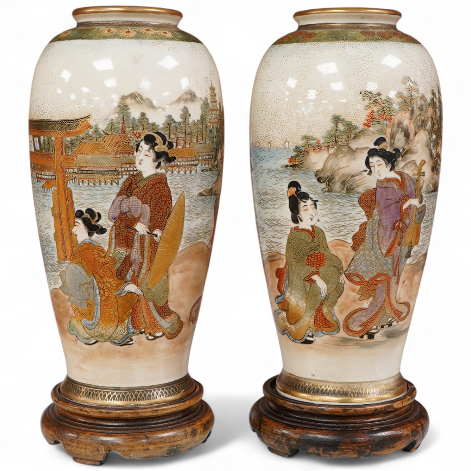 A pair of Japanese satsuma vases and stands, signed, Meiji period (1868-1912), 21cm total